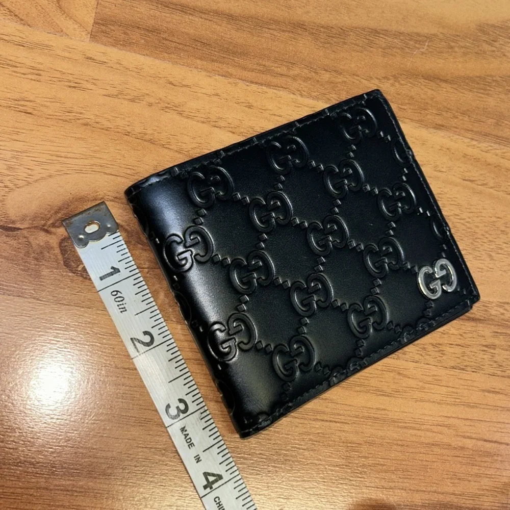 Authentic Gucci Dorian Signature Embossed Leather Bifold Wallet